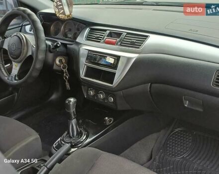 Черный Мицубиси Лансер, объемом двигателя 2 л и пробегом 286 тыс. км за 4000 $, фото 14 на Automoto.ua