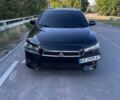 Черный Мицубиси Лансер, объемом двигателя 2 л и пробегом 240 тыс. км за 6200 $, фото 1 на Automoto.ua