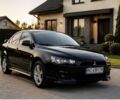 Чорний Міцубісі Lancer, об'ємом двигуна 2 л та пробігом 195 тис. км за 6584 $, фото 1 на Automoto.ua