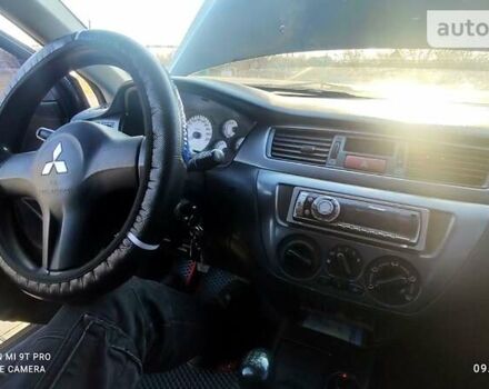 Черный Мицубиси Лансер, объемом двигателя 1.6 л и пробегом 213 тыс. км за 4600 $, фото 15 на Automoto.ua