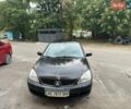 Черный Мицубиси Лансер, объемом двигателя 1.6 л и пробегом 209 тыс. км за 3199 $, фото 1 на Automoto.ua