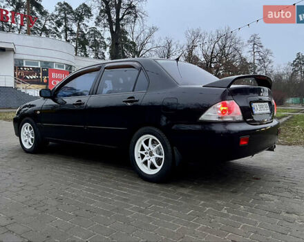 Чорний Міцубісі Lancer, об'ємом двигуна 1.6 л та пробігом 303 тис. км за 4350 $, фото 10 на Automoto.ua