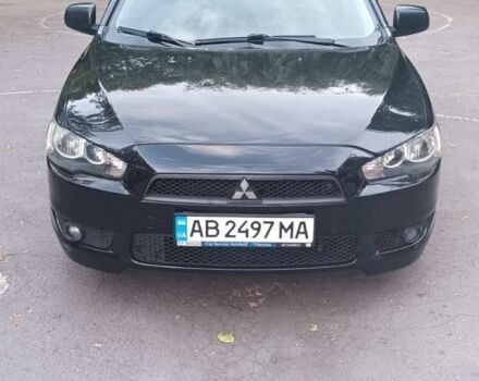 Черный Мицубиси Лансер, объемом двигателя 2 л и пробегом 210 тыс. км за 6000 $, фото 1 на Automoto.ua