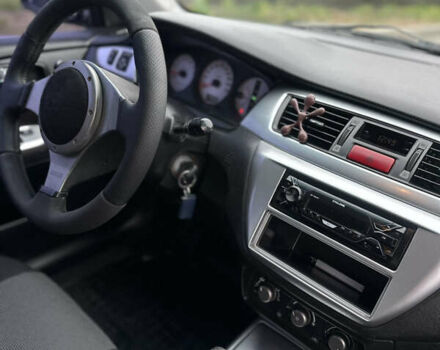 Черный Мицубиси Лансер, объемом двигателя 2 л и пробегом 260 тыс. км за 5300 $, фото 10 на Automoto.ua