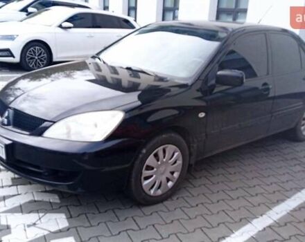 Черный Мицубиси Лансер, объемом двигателя 1.6 л и пробегом 223 тыс. км за 4300 $, фото 5 на Automoto.ua