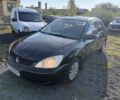 Чорний Міцубісі Lancer, об'ємом двигуна 1.6 л та пробігом 300 тис. км за 3011 $, фото 1 на Automoto.ua