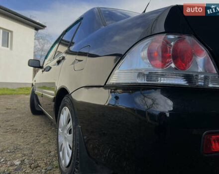 Чорний Міцубісі Lancer, об'ємом двигуна 1.58 л та пробігом 185 тис. км за 3750 $, фото 4 на Automoto.ua