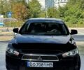 Черный Мицубиси Лансер, объемом двигателя 2 л и пробегом 220 тыс. км за 6099 $, фото 1 на Automoto.ua