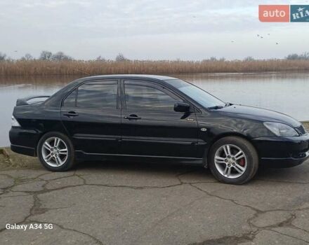 Черный Мицубиси Лансер, объемом двигателя 2 л и пробегом 286 тыс. км за 4000 $, фото 4 на Automoto.ua