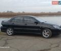 Черный Мицубиси Лансер, объемом двигателя 2 л и пробегом 286 тыс. км за 4000 $, фото 4 на Automoto.ua