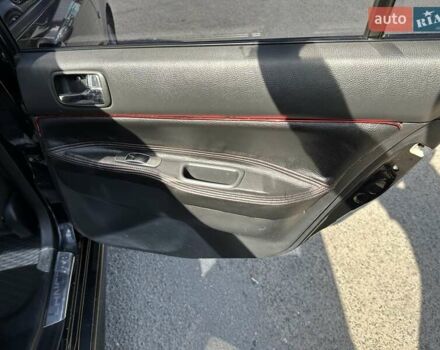 Черный Мицубиси Лансер, объемом двигателя 2 л и пробегом 272 тыс. км за 5514 $, фото 12 на Automoto.ua