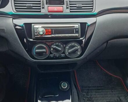 Чорний Міцубісі Lancer, об'ємом двигуна 1.6 л та пробігом 273 тис. км за 3999 $, фото 31 на Automoto.ua