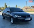 Чорний Міцубісі Lancer, об'ємом двигуна 1.58 л та пробігом 261 тис. км за 3650 $, фото 1 на Automoto.ua