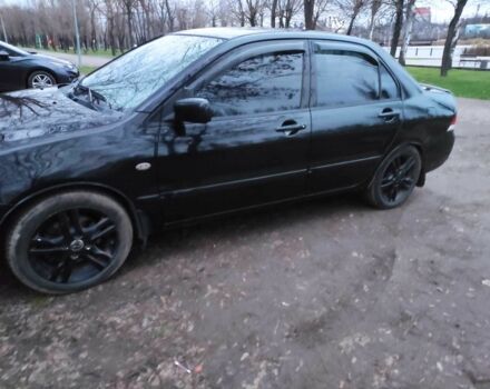 Чорний Міцубісі Lancer, об'ємом двигуна 1.6 л та пробігом 259 тис. км за 4500 $, фото 5 на Automoto.ua