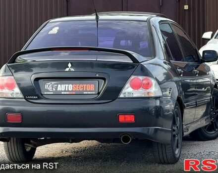 Черный Мицубиси Лансер, объемом двигателя 1.6 л и пробегом 260 тыс. км за 3700 $, фото 3 на Automoto.ua