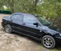 Чорний Міцубісі Lancer, об'ємом двигуна 1.6 л та пробігом 232 тис. км за 4200 $, фото 3 на Automoto.ua