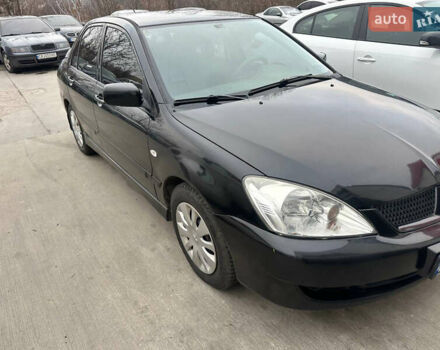 Черный Мицубиси Лансер, объемом двигателя 1.58 л и пробегом 290 тыс. км за 3000 $, фото 1 на Automoto.ua