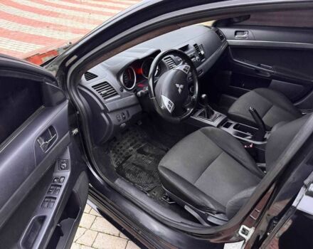 Черный Мицубиси Лансер, объемом двигателя 2 л и пробегом 217 тыс. км за 5500 $, фото 9 на Automoto.ua