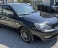 Чорний Міцубісі Lancer, об'ємом двигуна 1.6 л та пробігом 250 тис. км за 3494 $, фото 1 на Automoto.ua