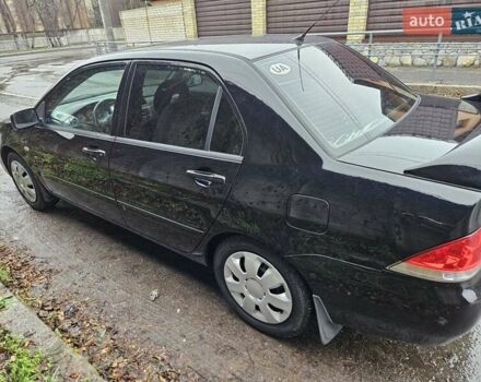 Черный Мицубиси Лансер, объемом двигателя 1.6 л и пробегом 152 тыс. км за 4999 $, фото 6 на Automoto.ua