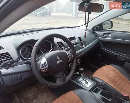 Черный Мицубиси Лансер, объемом двигателя 2 л и пробегом 195 тыс. км за 7899 $, фото 10 на Automoto.ua