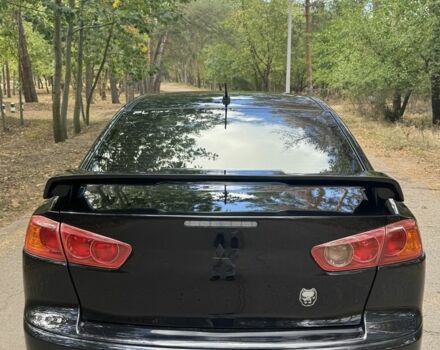 Черный Мицубиси Лансер, объемом двигателя 2 л и пробегом 280 тыс. км за 6800 $, фото 2 на Automoto.ua