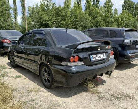 Черный Мицубиси Лансер, объемом двигателя 2 л и пробегом 161 тыс. км за 4500 $, фото 1 на Automoto.ua