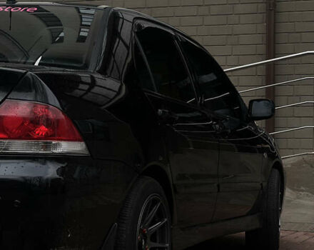 Черный Мицубиси Лансер, объемом двигателя 1.6 л и пробегом 211 тыс. км за 5700 $, фото 40 на Automoto.ua