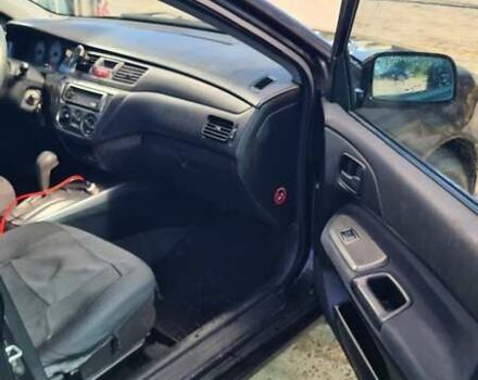 Черный Мицубиси Лансер, объемом двигателя 1.6 л и пробегом 185 тыс. км за 3300 $, фото 10 на Automoto.ua