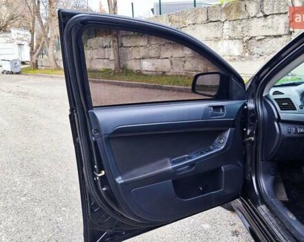Черный Мицубиси Лансер, объемом двигателя 2 л и пробегом 230 тыс. км за 7100 $, фото 7 на Automoto.ua