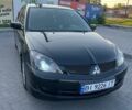 Чорний Міцубісі Lancer, об'ємом двигуна 2 л та пробігом 283 тис. км за 4600 $, фото 1 на Automoto.ua