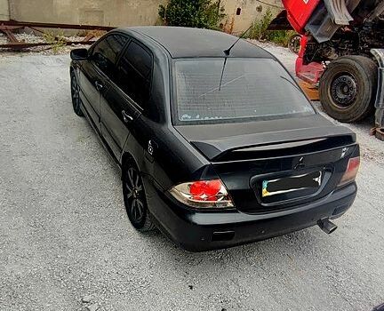 Чорний Міцубісі Lancer, об'ємом двигуна 2 л та пробігом 200 тис. км за 1800 $, фото 2 на Automoto.ua