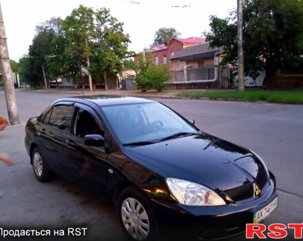 Черный Мицубиси Лансер, объемом двигателя 1.6 л и пробегом 247 тыс. км за 4000 $, фото 3 на Automoto.ua