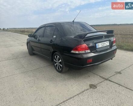 Чорний Міцубісі Lancer, об'ємом двигуна 1.6 л та пробігом 310 тис. км за 5100 $, фото 18 на Automoto.ua