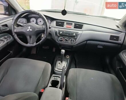 Чорний Міцубісі Lancer, об'ємом двигуна 1.58 л та пробігом 227 тис. км за 4100 $, фото 11 на Automoto.ua