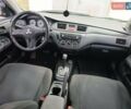 Чорний Міцубісі Lancer, об'ємом двигуна 1.58 л та пробігом 227 тис. км за 4100 $, фото 11 на Automoto.ua