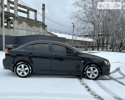 Чорний Міцубісі Lancer, об'ємом двигуна 2 л та пробігом 199 тис. км за 7000 $, фото 4 на Automoto.ua