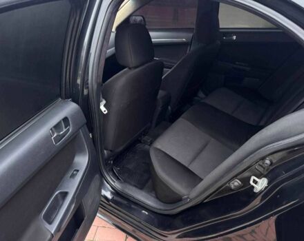 Черный Мицубиси Лансер, объемом двигателя 2 л и пробегом 217 тыс. км за 5500 $, фото 10 на Automoto.ua