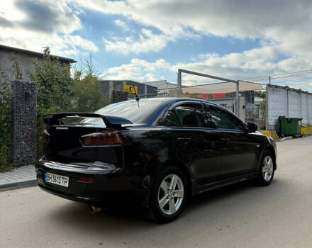 Черный Мицубиси Лансер, объемом двигателя 2 л и пробегом 219 тыс. км за 6400 $, фото 5 на Automoto.ua