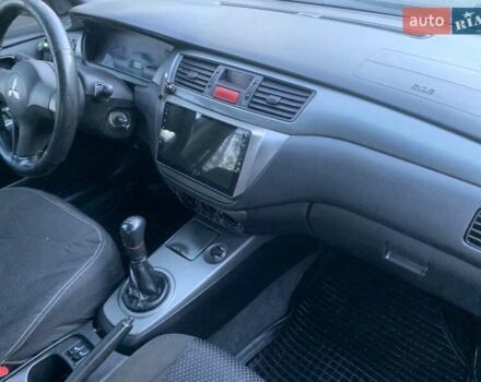 Чорний Міцубісі Lancer, об'ємом двигуна 1.58 л та пробігом 237 тис. км за 4300 $, фото 9 на Automoto.ua