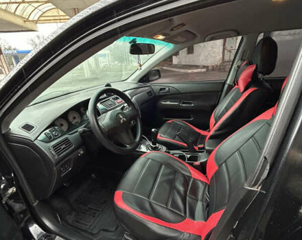 Черный Мицубиси Лансер, объемом двигателя 1.58 л и пробегом 254 тыс. км за 5000 $, фото 15 на Automoto.ua