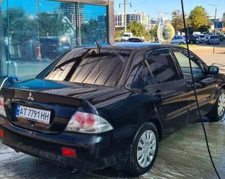 Черный Мицубиси Лансер, объемом двигателя 1.6 л и пробегом 185 тыс. км за 3300 $, фото 6 на Automoto.ua