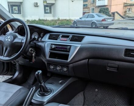 Черный Мицубиси Лансер, объемом двигателя 1.6 л и пробегом 226 тыс. км за 4800 $, фото 7 на Automoto.ua