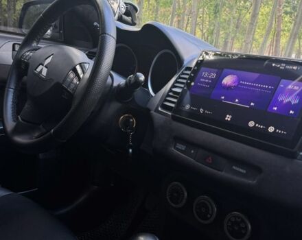 Черный Мицубиси Лансер, объемом двигателя 2 л и пробегом 280 тыс. км за 6800 $, фото 4 на Automoto.ua