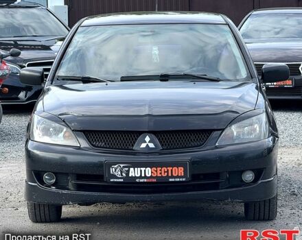 Черный Мицубиси Лансер, объемом двигателя 1.6 л и пробегом 260 тыс. км за 3700 $, фото 4 на Automoto.ua
