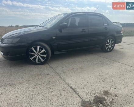 Чорний Міцубісі Lancer, об'ємом двигуна 1.6 л та пробігом 310 тис. км за 5100 $, фото 20 на Automoto.ua