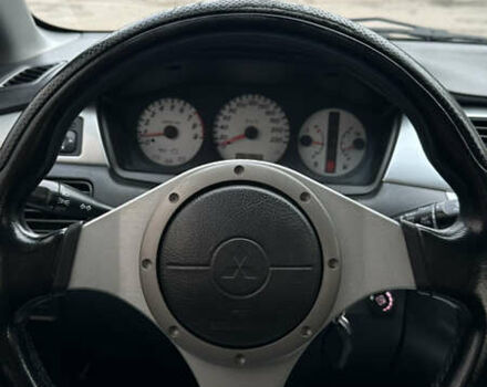 Черный Мицубиси Лансер, объемом двигателя 2 л и пробегом 143 тыс. км за 4999 $, фото 9 на Automoto.ua