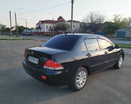 Черный Мицубиси Лансер, объемом двигателя 1.6 л и пробегом 32 тыс. км за 9000 $, фото 14 на Automoto.ua