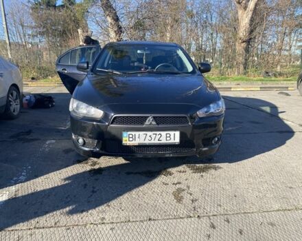 Черный Мицубиси Лансер, объемом двигателя 2 л и пробегом 372 тыс. км за 6200 $, фото 1 на Automoto.ua