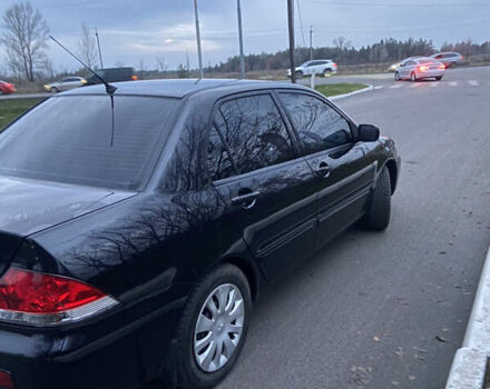 Черный Мицубиси Лансер, объемом двигателя 1.58 л и пробегом 213 тыс. км за 4900 $, фото 2 на Automoto.ua